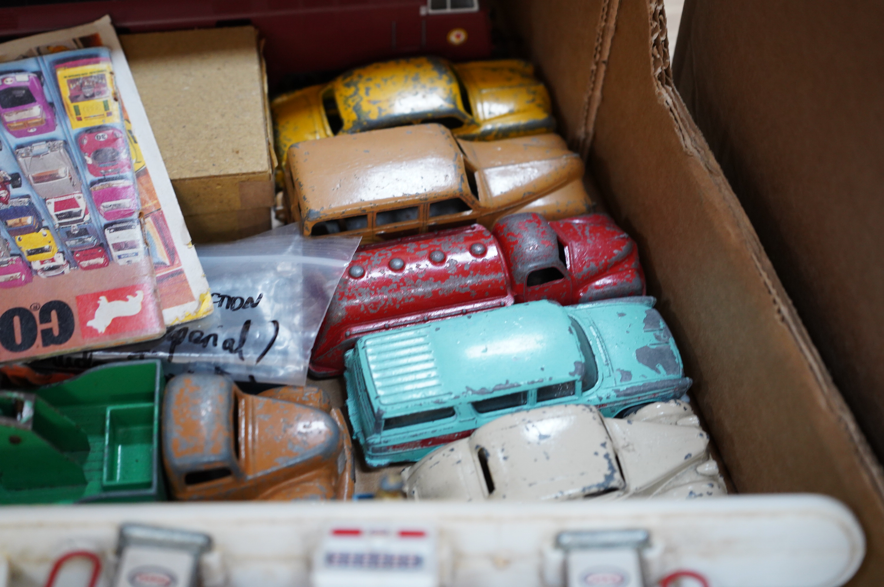 A collection diecast vehicles, lead figures, tinplate, etc. by Dinky Toys, Corgi Toys, Matchbox Series, etc. including; twenty 1950s/60s Dinky Toys, twelve Corgi Toys, two Matchbox Series Collectors Cases (41), both with